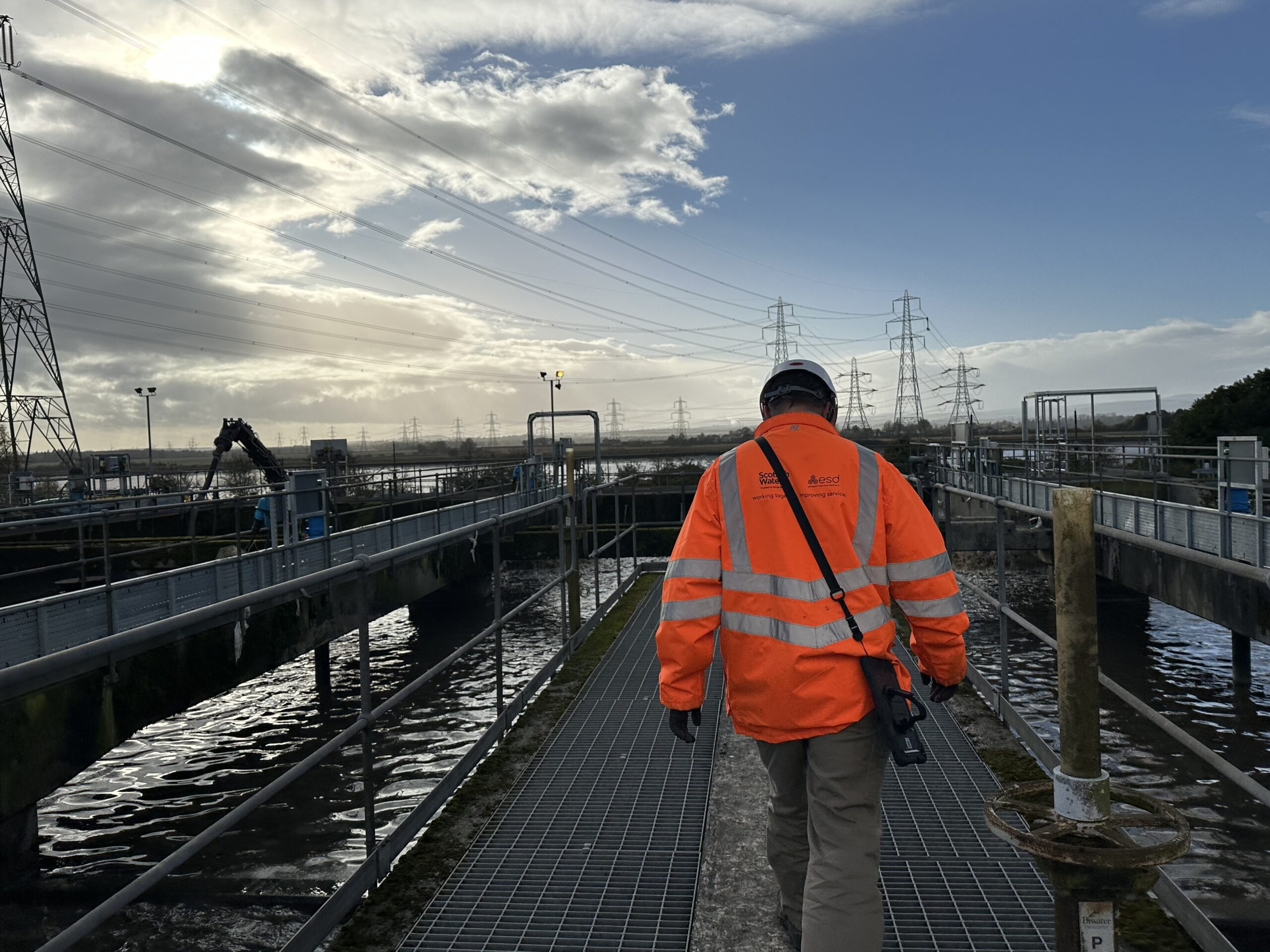 Programme Launches 1 An engineer in high-visibility orange PPE